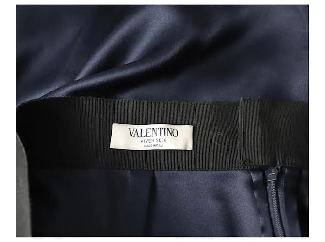Valentino Garavani Falda midi con parte delantera plisada en seda azul marino de Valentino 